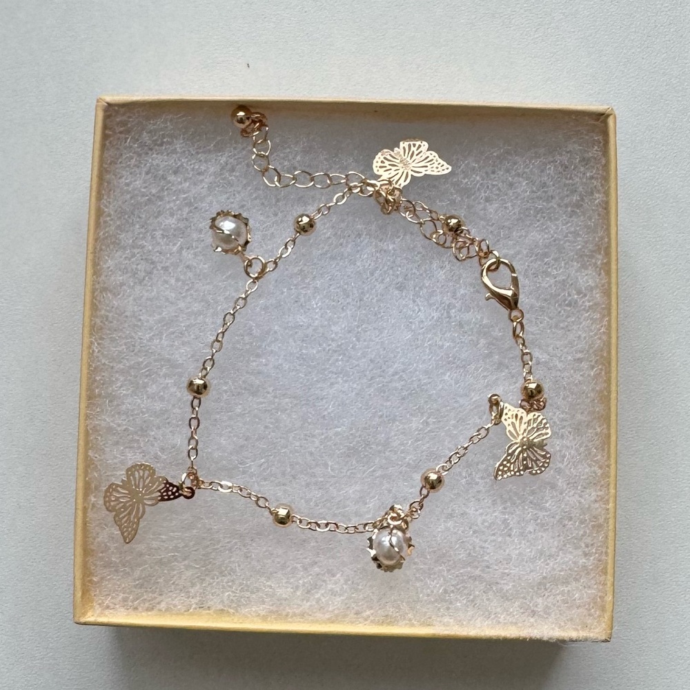 Gold-Plated Bracelet with Butterfly Charms and Imitation Pearls
